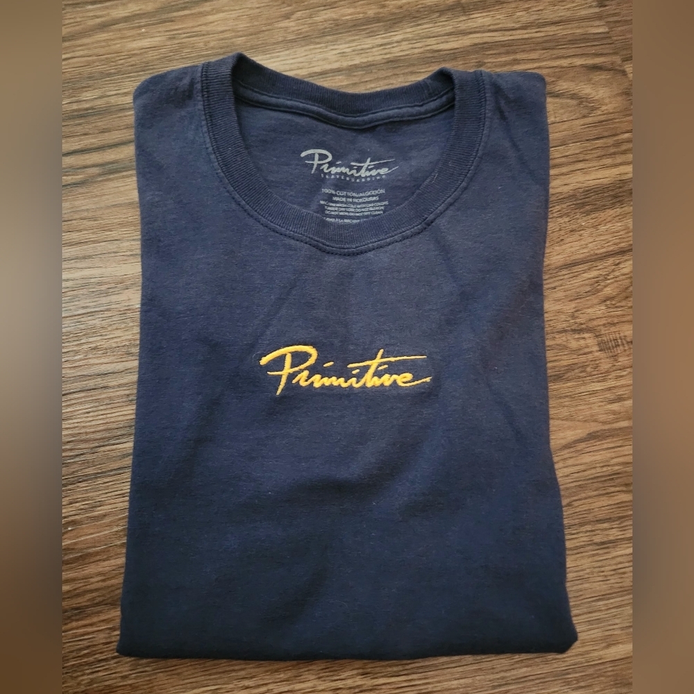 Primitive Dark Blue Tee with Gold Logo